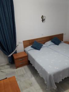 Posteľ alebo postele v izbe v ubytovaní Hostal Centro Sol