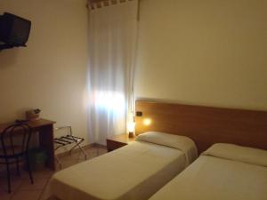 Postel nebo postele na pokoji v ubytování Albergo Pizzeria Sole