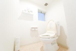 Ett badrum på Guest House Re-worth Yabacho1 202
