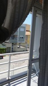 a balcony with a view of a city street at Apartamento Residencial Messina in Florianópolis