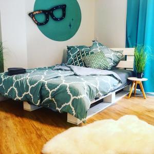 a bedroom with a bed with sunglasses on the wall at 5 Zimmer Loftstylewohnung in Bad Wörishofen in Bad Wörishofen