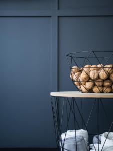 a basket of bagels sitting on top of a table at Ataner Apartamenty in Koszalin