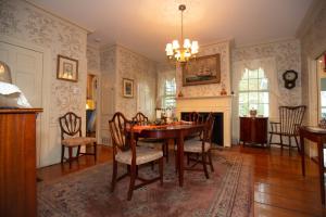 a dining room with a table and chairs at Clark Currier Inn in Newburyport
