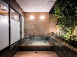 a jacuzziificialificialificialificialificialificialificialificialificialificialificial at Dogo Onsen Yachiyo 道後温泉八千代 in Matsuyama