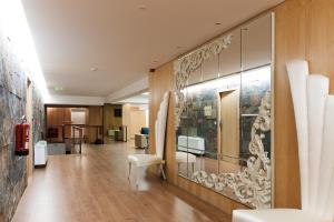 an office lobby with a large glass wall at Mondim AL & Spa in Mondim de Basto