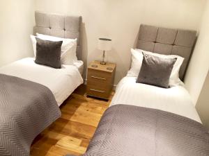 Cama o camas de una habitación en City Centre Apartment