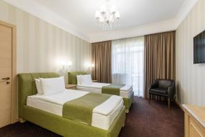 Кровать или кровати в номере Левада Парк-Отель