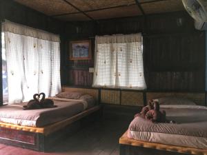 Ein Bett oder Betten in einem Zimmer der Unterkunft Phi Phi Green Hill Resort