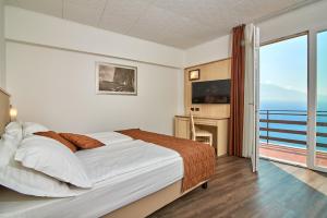 Postel nebo postele na pokoji v ubytování Hotel Le Balze - Aktiv & Wellness