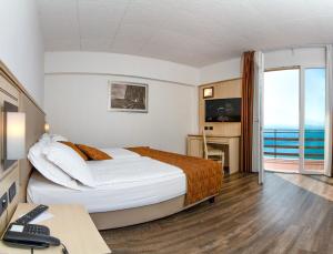 Postel nebo postele na pokoji v ubytování Hotel Le Balze - Aktiv & Wellness