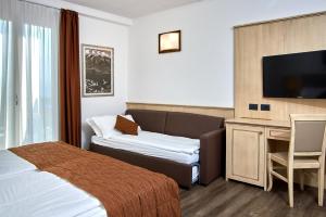 Postel nebo postele na pokoji v ubytování Hotel Le Balze - Aktiv & Wellness
