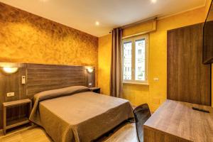 Voodi või voodid majutusasutuse Hotel Osimar toas