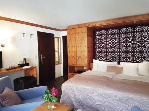 Postel nebo postele na pokoji v ubytování Le Mirabeau Resort & Spa