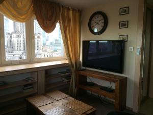 Televízia a/alebo spoločenská miestnosť v ubytovaní Amica Apartment by WarsawResidence Group