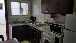 Kuchyň nebo kuchyňský kout v ubytování Appartement au Centre de Martil