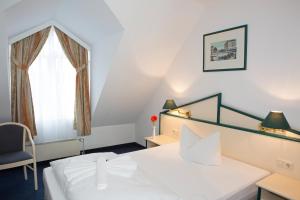 Postel nebo postele na pokoji v ubytování Hotel 3 Linden