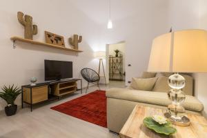 a living room with a couch and a table at Lovely New home, Trastevere! in Rome