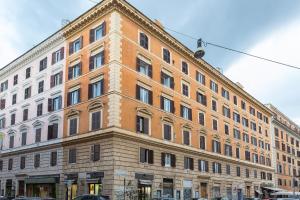 a large brick building on the corner of a street at Lovely New home, Trastevere! in Rome