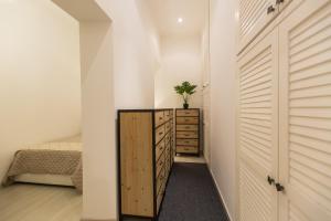 a bedroom with a closet and a dresser and a bed at Lovely New home, Trastevere! in Rome