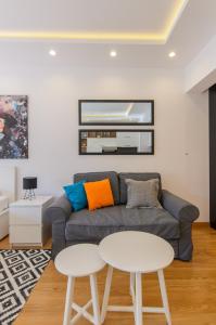 a living room with a couch and a table at Sava Smart Apartment in Belgrade