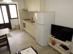Kuchyň nebo kuchyňský kout v ubytování Apartments Simicev