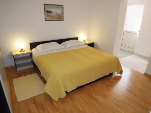 Postel nebo postele na pokoji v ubytování Apartments Simicev