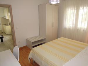 Postel nebo postele na pokoji v ubytování Apartments Simicev