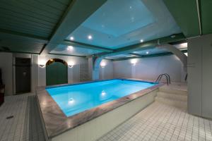a large swimming pool in a house at Unterwirt in Waging am See