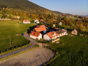 an aerial view of a village with houses and a road at Apartament Leśna in Limanowa