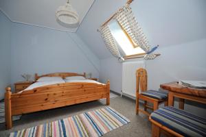 Cama o camas de una habitación en Gästehaus Macheiner