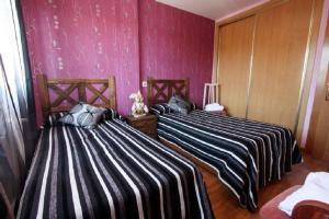 A bed or beds in a room at Casa Rural Ribera del Duero