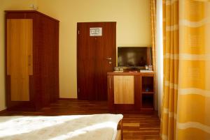TV a/nebo společenská místnost v ubytování Hotel Penzion Na Hradě