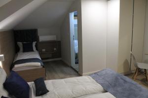 Postel nebo postele na pokoji v ubytování Sleep Inn Prishtina