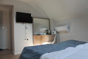 Postel nebo postele na pokoji v ubytování Sleep Inn Prishtina
