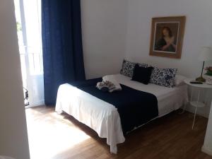A bed or beds in a room at Casa de Huéspedes Prada