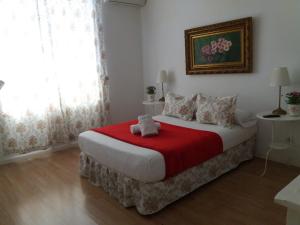 A bed or beds in a room at Casa de Huéspedes Prada