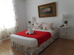 A bed or beds in a room at Casa de Huéspedes Prada