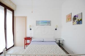 A bed or beds in a room at Cortesia 4