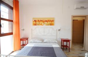 A bed or beds in a room at Cortesia 4