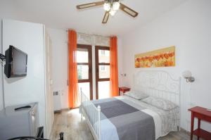 A bed or beds in a room at Cortesia 4