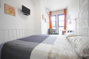 A bed or beds in a room at Cortesia 4