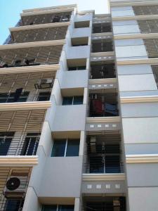 a tall white apartment building with many windows at Hyperion Sea View in Cox's Bazar