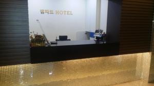 an office with a reception desk in a building at Rampart Hotel in Gwangmyeong