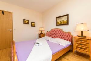 Postel nebo postele na pokoji v ubytování Apartments Luxury view
