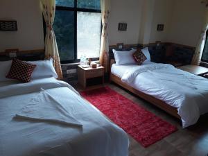 Voodi või voodid majutusasutuse Peacock - a family-run hotel toas