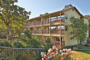 an apartment building with balconies and flowers at Westcliff Lodge in Hood River