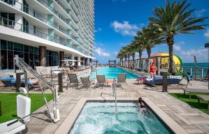 a swimming pool at a hotel with a resort at LYFE 4111 S Ocean dr in Hollywood