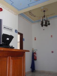 a room with a podium and a fire extinguisher at "O Viajante" Low Cost Hotel in Estremoz