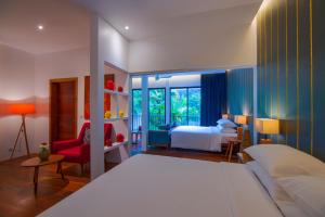 a bedroom with a white bed and a room with a bedsenalsenal at Silver Urban in Siem Reap +93 photos
