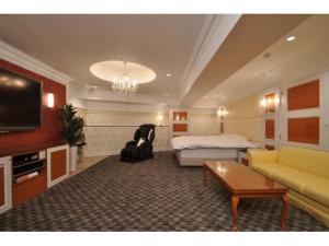 TV o dispositivi per l'intrattenimento presso Hotel ShaSha Resort Suma